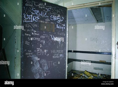 Graffiti on the inside of a prison holding cell Stock Photo - Alamy