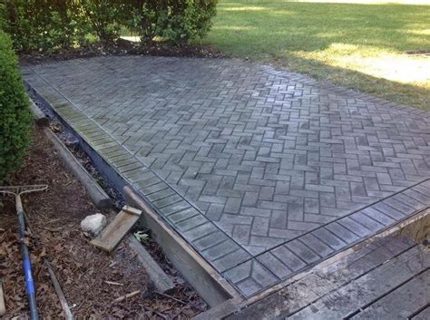 Stamped concrete patio. Herringbone interior, brick border stamps ...