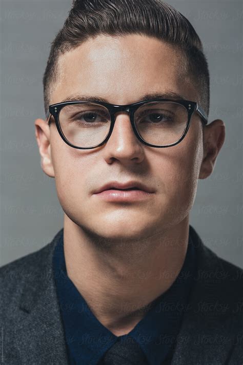 "A Portrait Of A Young Man Wearing Black Rimmed Eyeglasses" by Stocksy ...