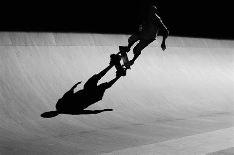 Skateboarder Riding Ramp At Skate Park Photograph by David Madison - Fine Art America