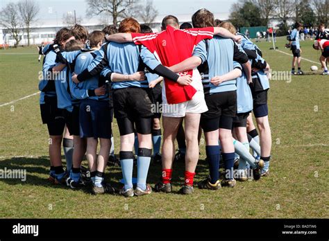 Boys rugby team group huddle before the match Stock Photo - Alamy