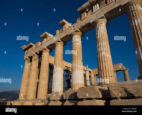 Columns of Parthenon temple on Acropolis of Athens, Greece at sunset ...