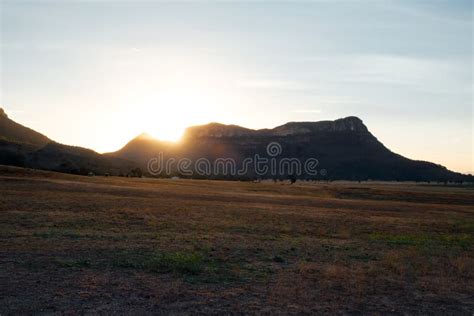 Sunset Sunbeams Sunburst As they Hit the Mountain Edge Stock Image - Image of undulating, canyon ...