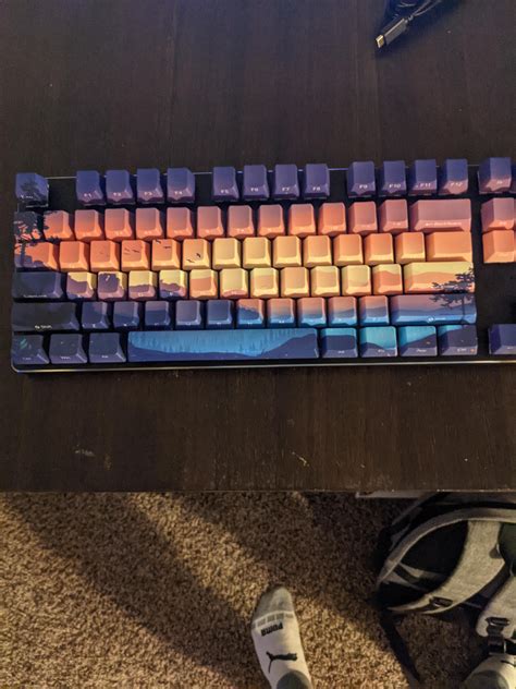 My first custom keyboard! I tried to make the lighting match the caps ...