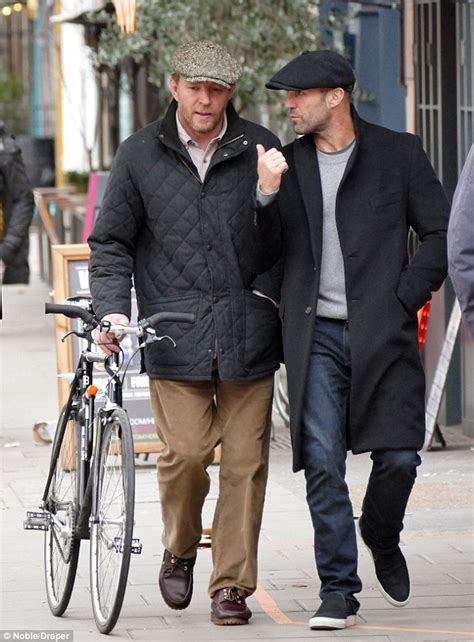 Guy Ritchie and Jason Statham wear matching caps for lads' day out ...