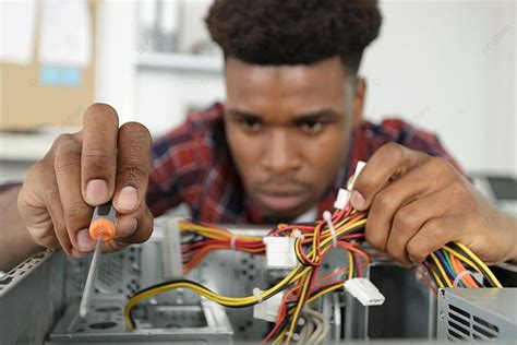 Young Man Repairing Motherboard From Pc Photo Background And Picture ...