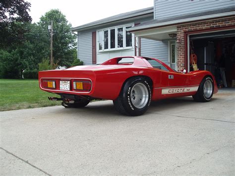 a red sports car parked in front of a house