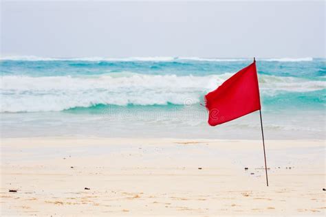 Red flag on beach stock image. Image of caribbean, wave - 12419761