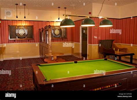 the new market pub games room with pool table and darts boards Stock Photo - Alamy