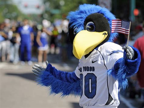 "The Bird", the mascot of the U.S. Air Force Academy, waves the U.S. flag during a parade in ...