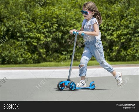 Child Riding Scooter. Image & Photo (Free Trial) | Bigstock