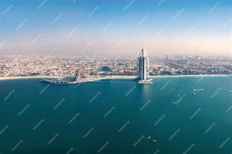 Premium Photo | Burj al arab hotel in dubai uae aerial view from helicopter