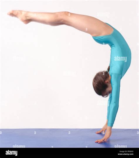 Gymnast performing backflip, side view Stock Photo - Alamy