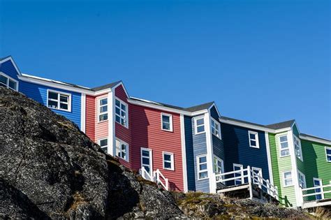 Colorful modern housing is common in the rocky surroundings in ...