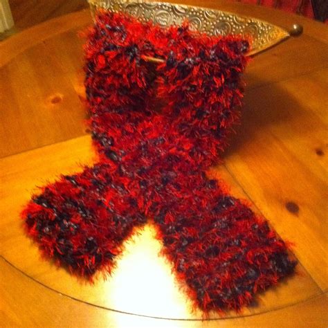 Red & Black Knitted Scarf using size 50 knitting needles with black eyelash yarn and red fun fur ...