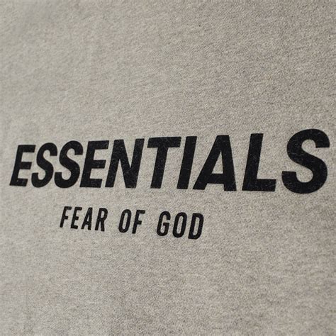 FEAR OF GOD ESSENTIALS Relaxed Back Logo Hoody Dark Oatmeal | END. (US)