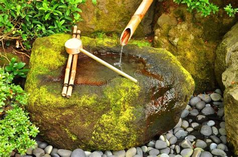 Photo about A colorful Japanese bamboo fountain in a Japanese garden in ...