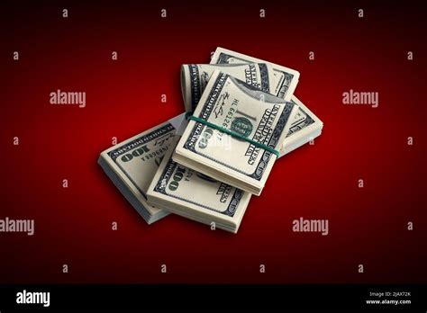 Bundle of US dollar bills on crimson red background. Pack of american money with high resolution ...