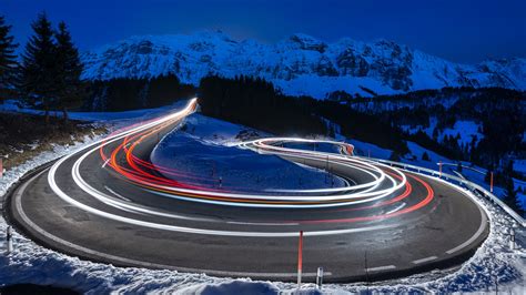 Photography Of Curved Lighting Road Surrounded Snow Covered Mountains 4K 5K HD Wallpapers | HD ...