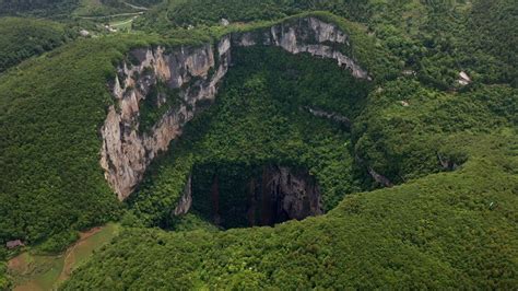 China's huge and mysterious Xiaozhai Tiankeng sinkhole - BBC Reel