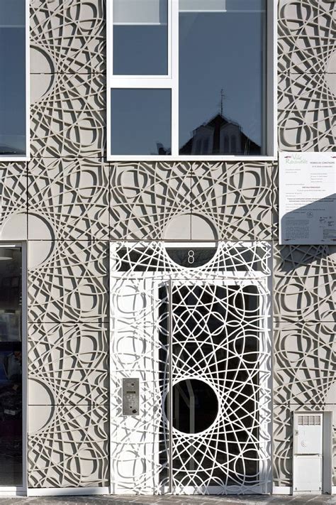 This building facade is made up of decorative concrete panels inspired ...