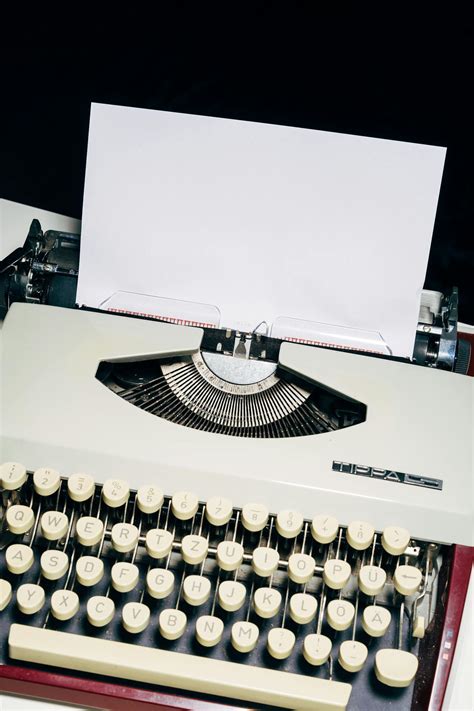 White and Black Typewriter on White Table · Free Stock Photo