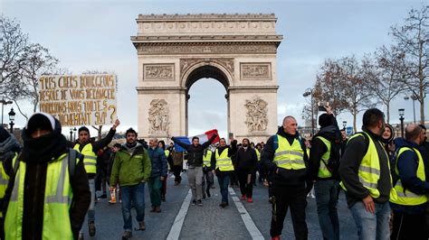 ‘Yellow Vests’ Descend on Paris as Police Arrest Hundreds and Fire Tear ...