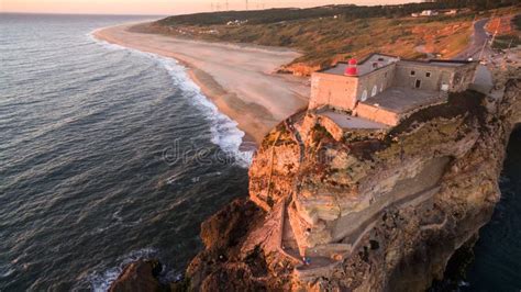 Aerial View of Ocean, North Beach and Nazare Lighthouse at Sunset, Portugal Stock Photo - Image ...