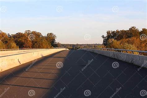 Abandoned road at sunset stock photo. Image of trees - 105314004