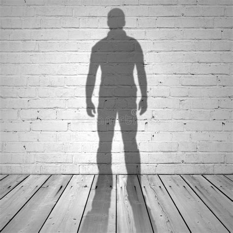 Shadow Of A Man On White Brick Wall Stock Photo - Image: 44721986