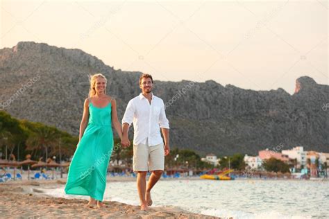 Couple walking at sunset Stock Photo by ©Maridav 54892077