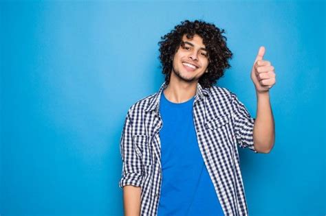 Young curly man with thumbs up isolated ... | Free Photo #Freepik #freephoto #fashion #man # ...