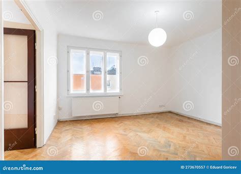 An Empty Room in an Apartment with a Wardrobe and a Wooden Parquet Floor Stock Image - Image of ...