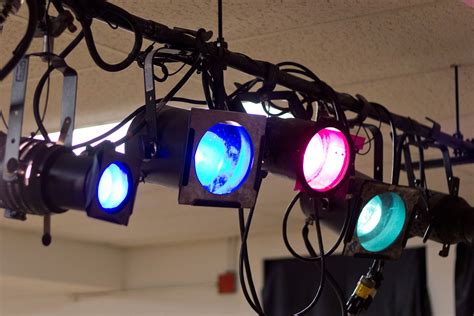 several different colored lights hanging from the ceiling