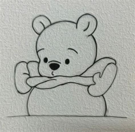 a drawing of a teddy bear sitting on top of a white wall with his arms ...