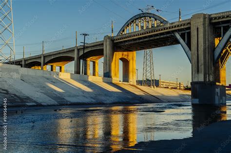 Sunlight on Los Angeles river embankment and 6th street bridge, Los ...