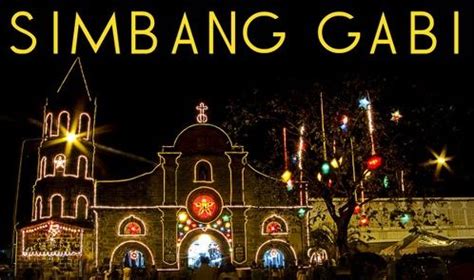 a large building with lights on it and the words simbang gabi above it