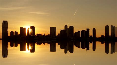 silhouette of skyline city panorama view at sunset magic hour light Stock Video Footage 00:14 ...