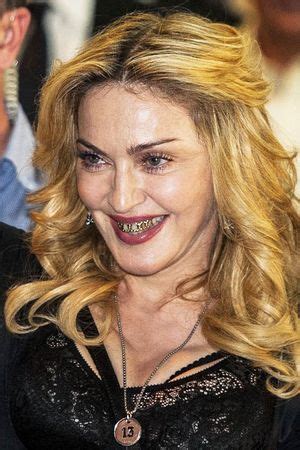 Together.Com: Madonna wearing gold grills on her teeth!