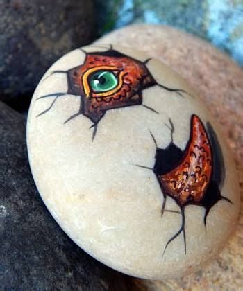 rock painting egg with dinosaur eye | Painted rocks, Rock painting art, Diy rock art