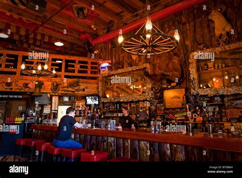 Tourist sits at the bar of the Red Dog Saloon in Juneau, Southeast ...