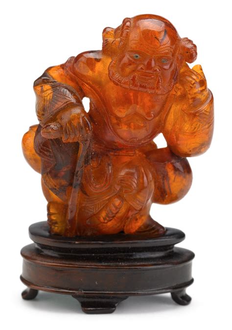 Lot 462 - Chinese amber carving of an Immortal