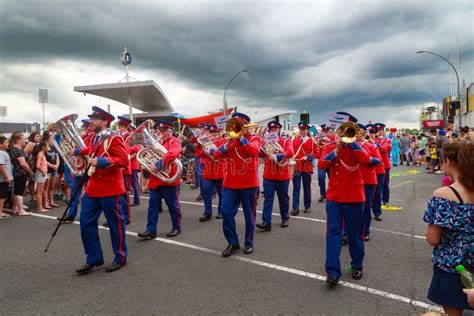 A Brass Band in Red Uniforms Marching Down the Street Editorial Image - Image of marching, music ...