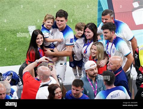 England's Harry Maguire poses with wife Fern Hawkins (left), daughter Lillie Saint Maguire and ...