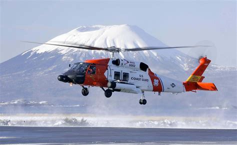 Coast Guard Sitka MH-60T Jayhawk aircrew rescue three from Chilkat River