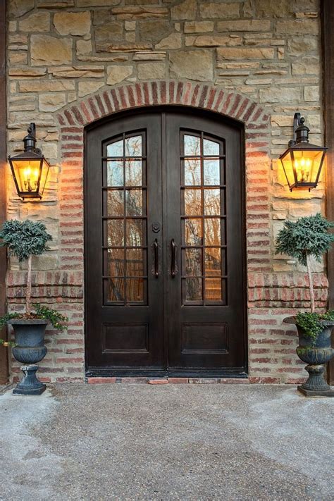 Iron and glass front doors with stone and brick accent Front doors ...