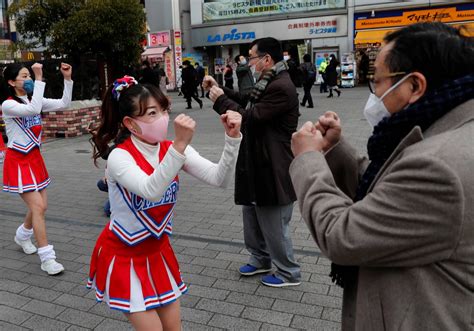 Cheerleaders lift Tokyo's spirits as coronavirus cases surge - The ...