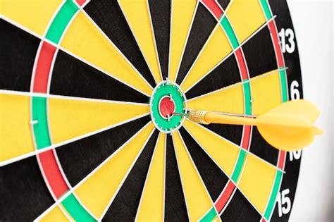 Premium Photo | A dart board with an arrow in bullseye close up, goals ...