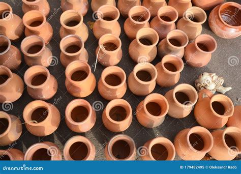 Rows of Unglazed Clay Pottery Jars, Jugs and Pots for Cooking without Lids Stock Image - Image ...