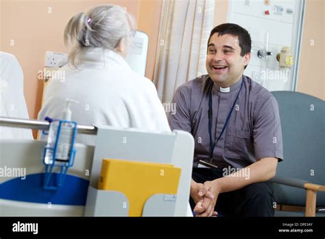 Chaplain on hospital visit chatting to patient Stock Photo: 61160763 - Alamy